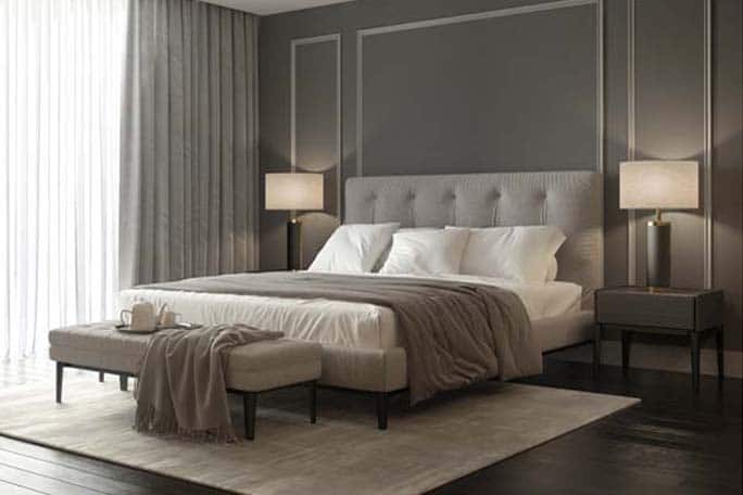 Classic grey bedroom interior with grey buttoned bed and luxury
